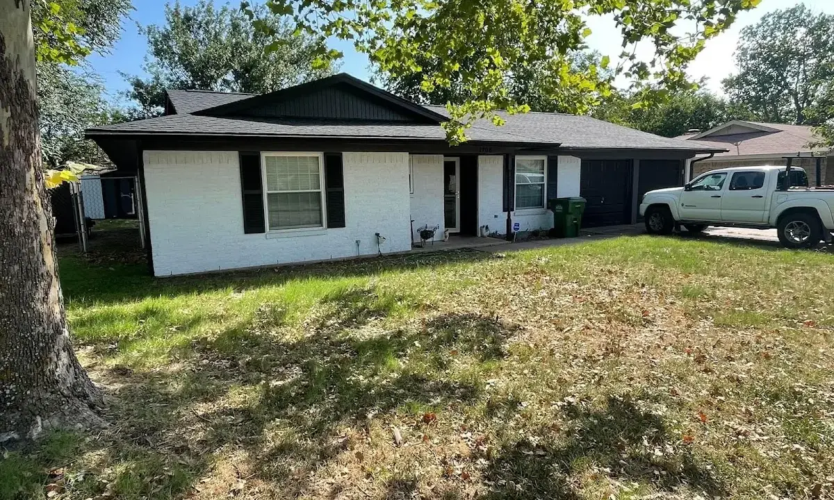 Professional roofing crew working on a residential roof in Perkasie